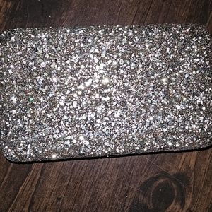 Small gold sparkling hard shell clutch